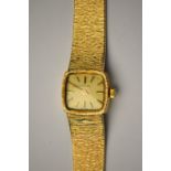 A lady's 9ct gold Longines wristwatch, the 17 jewel movement with champagne tonneau dial,