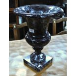 A large turned marble urn on square foot,