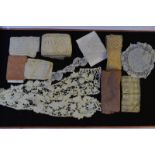 A quantity of assorted lace lengths on card, an ivory lace jacket,