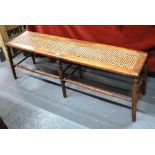 A cane seat mahogany bench/window seat circa 1900,