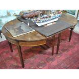 A 19th century mahogany demi-lune dining table,