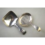 A George III silver caddy spoon with bright-cut handle and oval dished bowl with wriggle-work