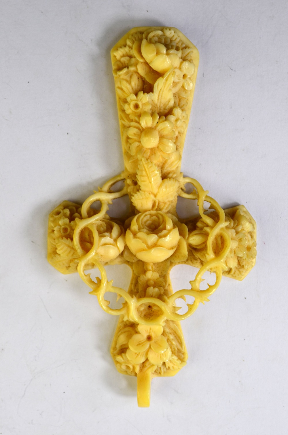 A Victorian ornate carved ivory cross of rose motif in high relief, with crown of thorns in centre, - Image 2 of 4