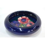 Moorcroft small circular bowl with everted rim, blue ground, decorated with the anemone pattern, 14.