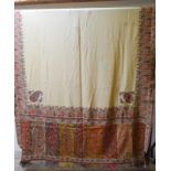 A Kashmiri late 19th century unbleached silk shawl finely worked in coloured red/green/yellow silks