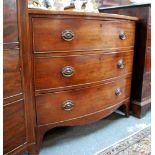 A Victorian mahogany bowfront chest of three long graduated drawers raised on splay bracket feet,