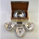 A pair of Edwardian embossed and pierced silver heart-shaped pin dishes, Birmingham 1908,