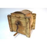 A 19th century pine butter churn with crank handle