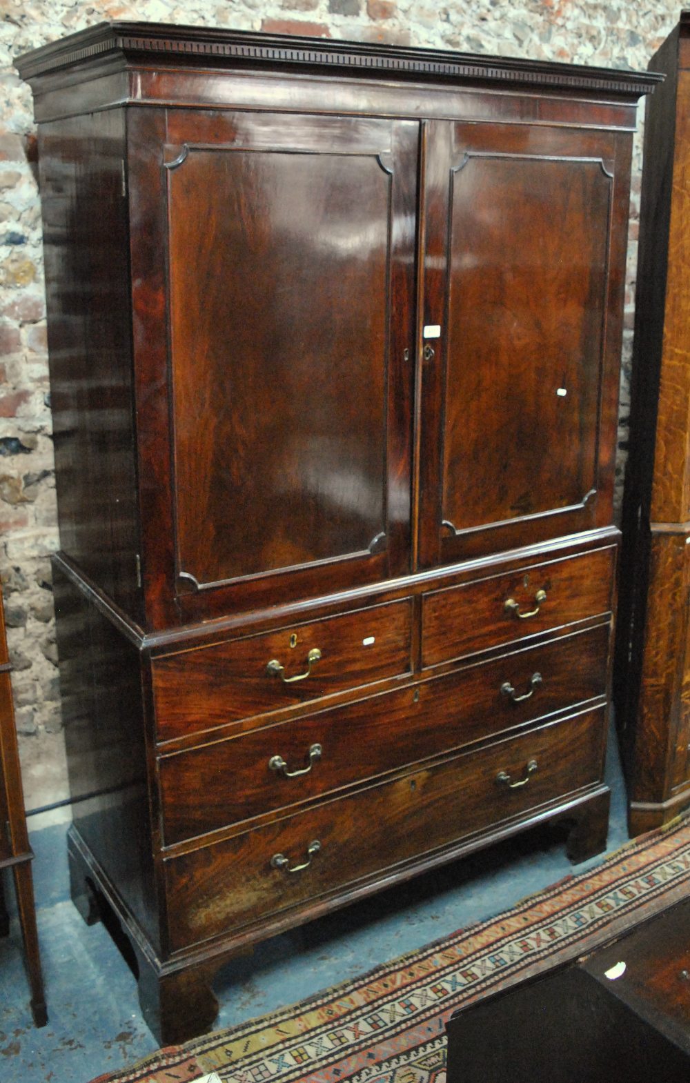 A 19th century mahogany linen press,