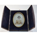 A Victorian watercolour portrait miniature on card of a lady in lace cap, unsigned, 12 x 8 cm,