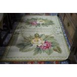 A small Aubusson style runner, the pale green ground with three floral panels,