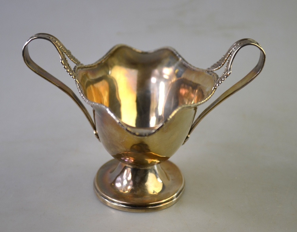 A small late Victorian silver half-reeded cream jug with decorative rim and scroll handle, - Image 3 of 6