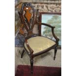 An Edwardian Sheraton Revival inlaid walnut salon chair with tulip fret cut splat over shaped urns