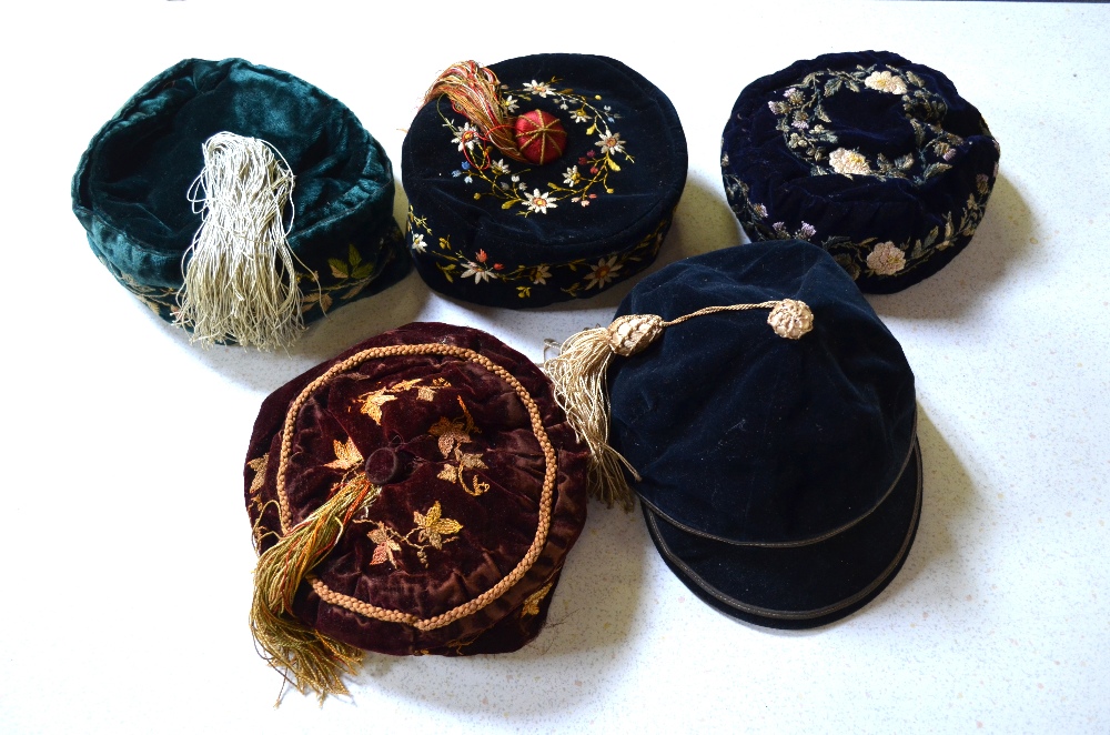 Five early 20th century smoking hats comprising; a black velvet floral embroidered hat with tassel, - Image 3 of 6