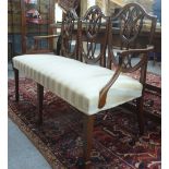 A 19th century Hepplewhite-style triple chair back settee,