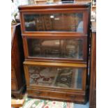 A graduated walnut three tier library bookcase by Globe Wernicke,