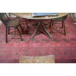 An Afghan small carpet with repeating gul design on red ground within repeating borders,