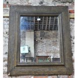 An antique Moorish style picture frame in the Liberty manner, now as a mirror,