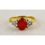 An oval fire opal and diamond boat shaped cluster ring,
