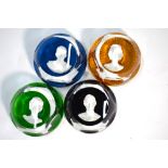 Four Baccarat sulphide glass paperweights decorated with the portrait busts of Queen Elizabeth II