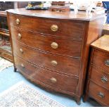 A George III mahogany bow front chest of four long graduated drawers raised on splayed bracket feet