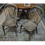 A set of four wheel back Windsor chairs with elm seats and crinoline stretchers (4)