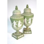 A pair of Wedgwood green Jasper Ware classical urns and covers with acorn finials, 20th century, 27.