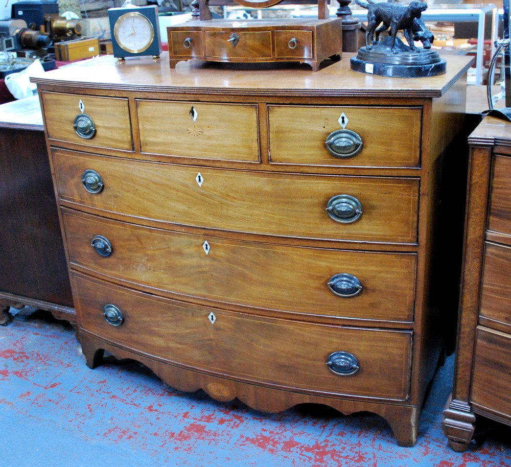 A Victorian mahogany bowfront chest of three short over three long graduated drawers,