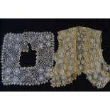 A collection of 19th century and other lace to include collars, bodice panels, lace tabards,