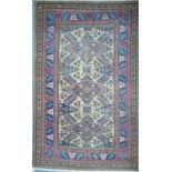 A Caucasian camel ground rug with complex geometric design within repeating double guarded border,
