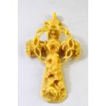A Victorian ornate carved ivory cross of rose motif in high relief, with crown of thorns in centre,