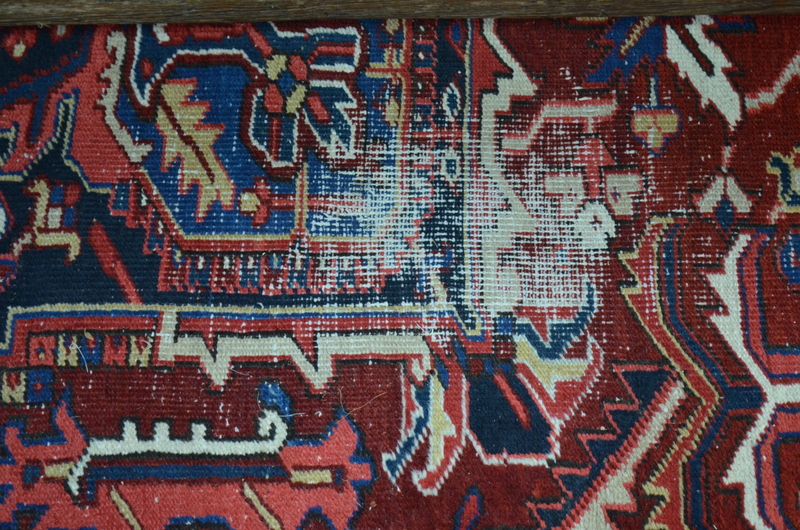 A Persian Heriz carpet, the large central blue medallion on red ground with stylised floral design, - Image 4 of 7