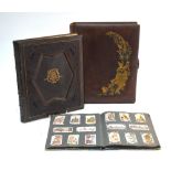 A Victorian leather photograph with decorative metal foliate mount dated 1891,