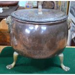 A Victorian oval copper coal box and cover with brass lion-mask handles and claw feet,