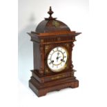 A continental oak cased mantel clock with Ungens branded movement,