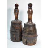 An unusual matched pair of antique turned elm bottles of mallet form with iron bands (by repute,