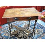 A 17th century oak side table, the wide two rectangular plank top over a moulded frieze with drawer,