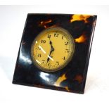 An Art Deco style tortoiseshell and gilt brass strut clock, 9.