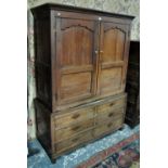 An 18th century oak livery cupboard in two parts,