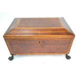 A 19th century satinwood casket raised on cast paw feet,