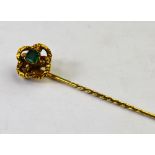 Victorian stick pin set square emerald in textured knot setting,