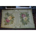 A small Aubusson style runner, the pale green ground with two floral lozenges,
