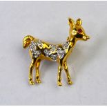An 18ct yellow and white gold Bambi brooch set with small diamonds and ruby, approx 2.