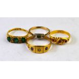 A collection of four stone set rings including ruby and diamond, green stone and rose diamond,