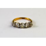 A five stone old cut diamond ring, yellow and white metal set stamped 18ct,