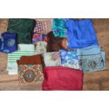 A collection of mostly silk vintage scarves