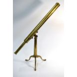A 19th century brass tube table top telescope on folding tripod stand,