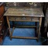 A 17th/18th century joint oak side table, the plank top over a frieze drawer,