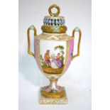 An urn-shaped Dresden vase with reticulated cover,