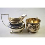 A George III silver milk jug on ball feet, to/w a heavy quality Christening mug (2), 8.